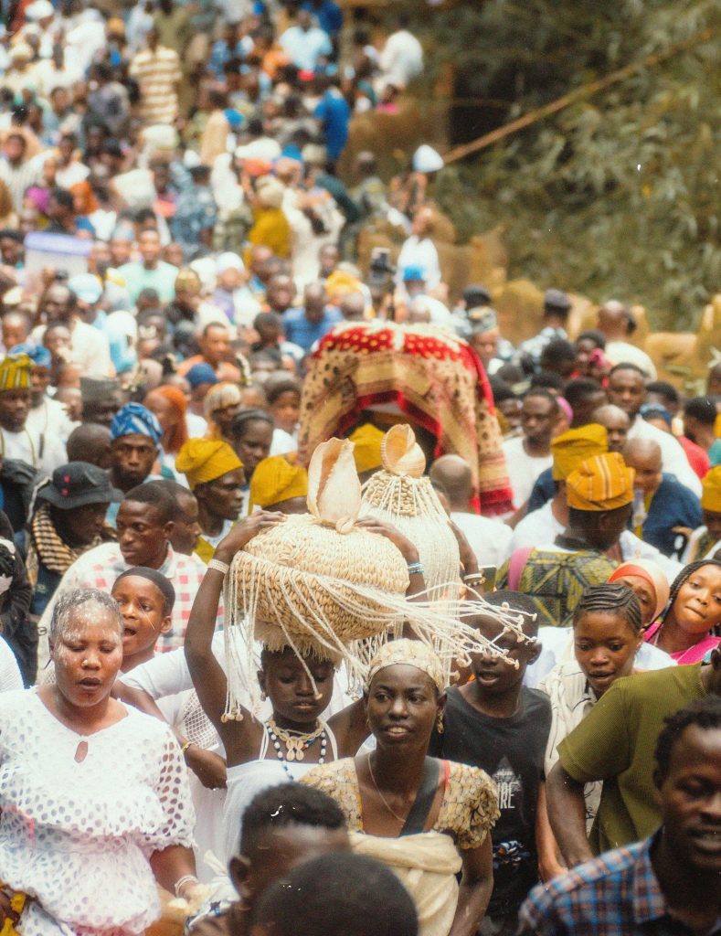 A lively festival scene with people in traditional attire, showcasing rich cultural diversity.