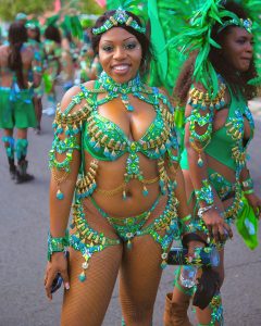 Vibrant carnival scene in Basseterre, showcasing elaborate costumes and joyous participants.