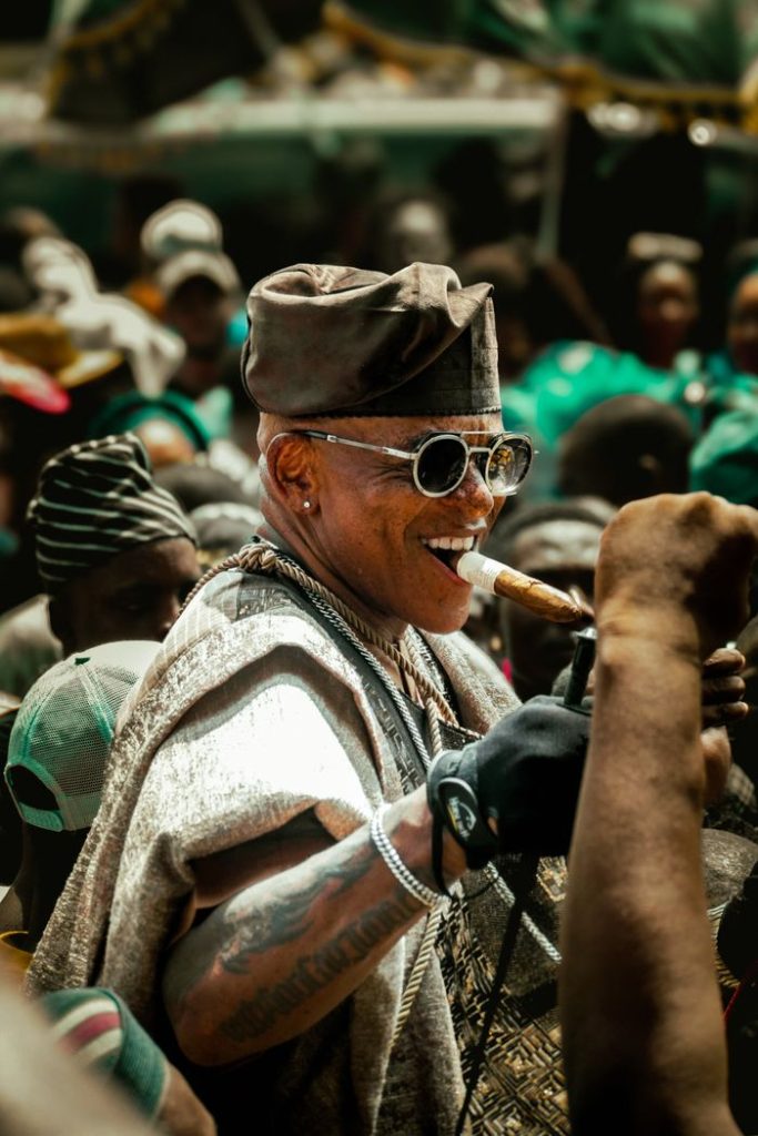Colorful depiction of the Ojude Oba festival in Ijebu Ode, showcasing Yoruba attire and culture.
