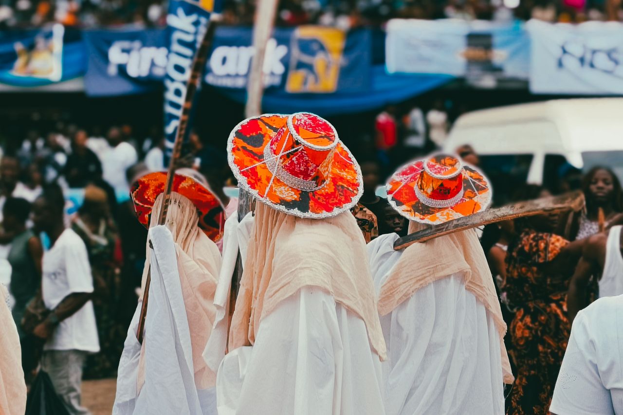 Vibrant festival scene with participants in traditional attire in Lagos, Nigeria.