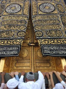 Pilgrims gather at the ornate door of the Kaaba in Mecca, Saudi Arabia.